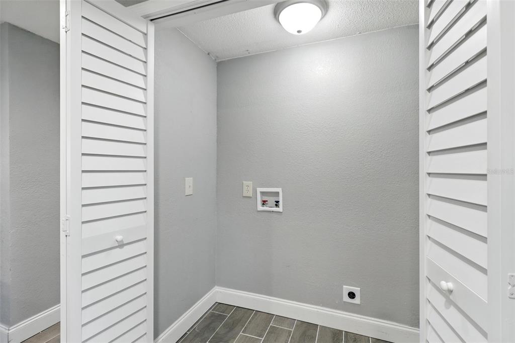 8035 Gulf Way Hudson, FL 34667 - Photo 13 of 26 a view of a room with racks on the wall
