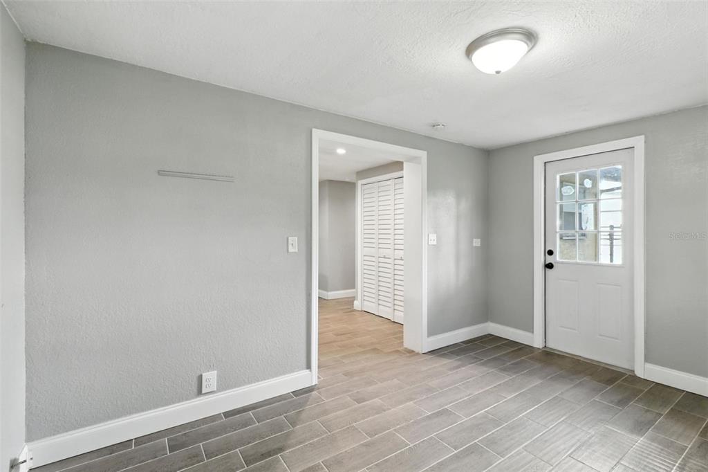 8035 Gulf Way Hudson, FL 34667 - Photo 15 of 26 an empty room with wooden floor and closet