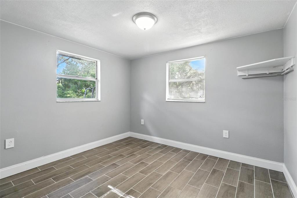 8035 Gulf Way Hudson, FL 34667 - Photo 21 of 26 a view of room with hardwood floor and window