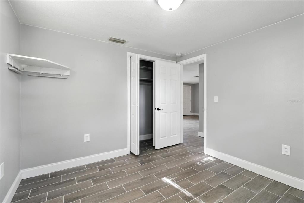 8035 Gulf Way Hudson, FL 34667 - Photo 22 of 26 a view of an empty room with closet and a window