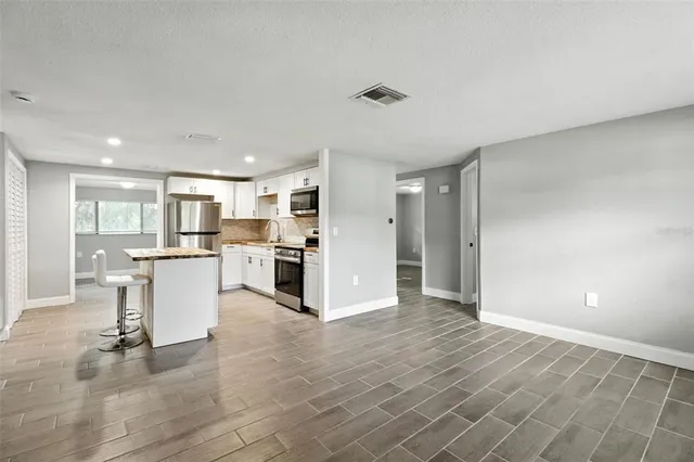 a view of kitchen with wooden floor