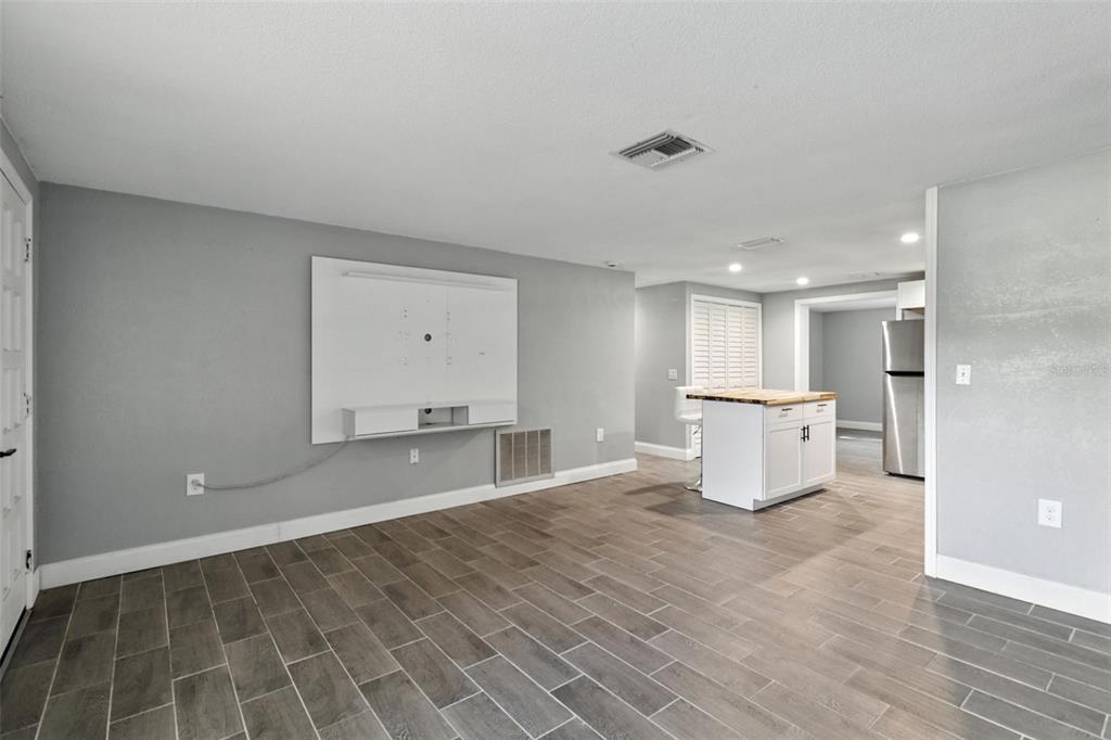 8035 Gulf Way Hudson, FL 34667 - Photo 6 of 26 a view of a kitchen with a sink and a refrigerator