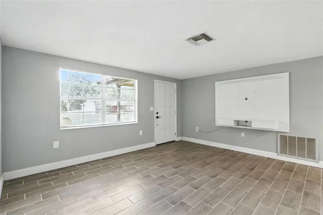 a view of an empty room with a window