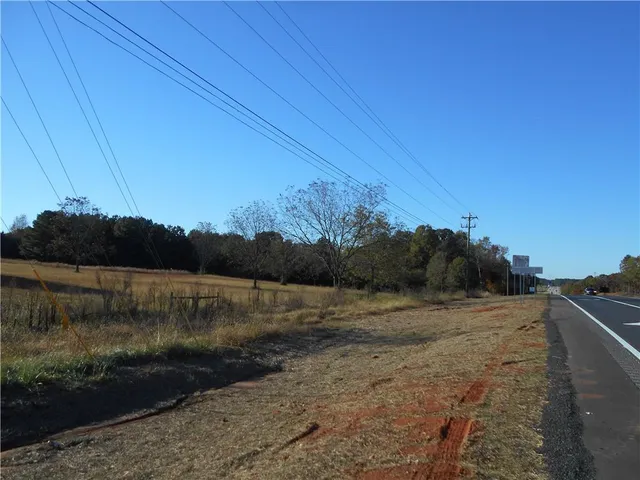 a view of a road with a building in the background