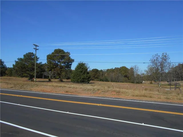 a view of a yard covered with trees