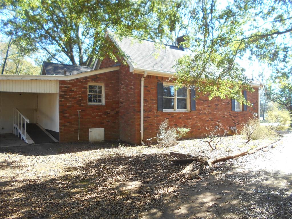1230 Good Hope Road Monroe, GA 30655 - Photo 37 of 76 a view of a house with a yard covered in snow