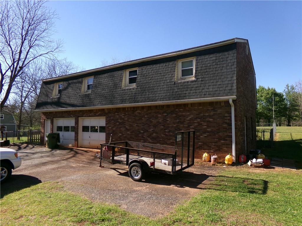 1230 Good Hope Road Monroe, GA 30655 - Photo 38 of 76 a view of a car park in front of house