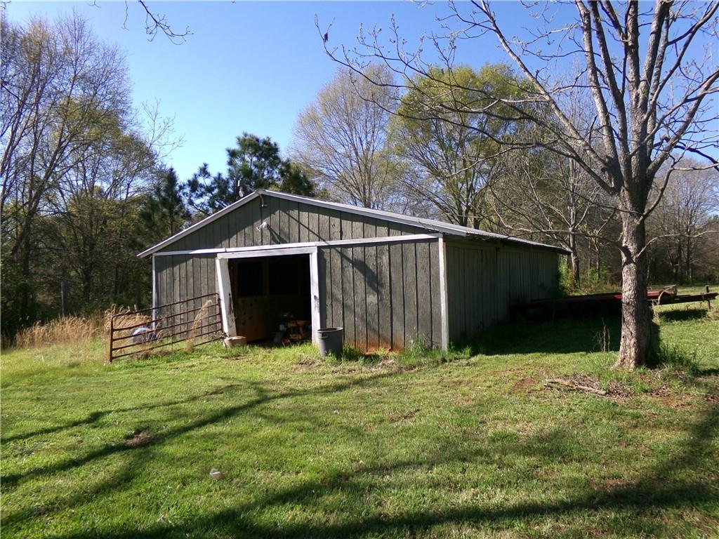 1230 Good Hope Road Monroe, GA 30655 - Photo 39 of 76 a view of a back yard of the house