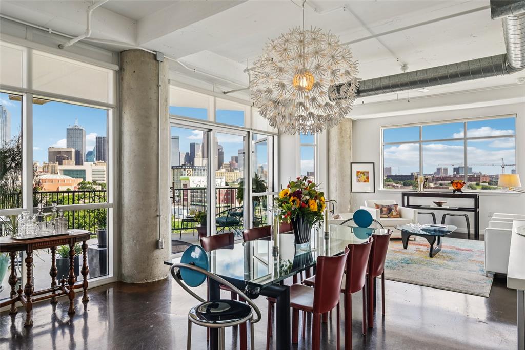 a view of a dining room with furniture wooden floor and chandelier