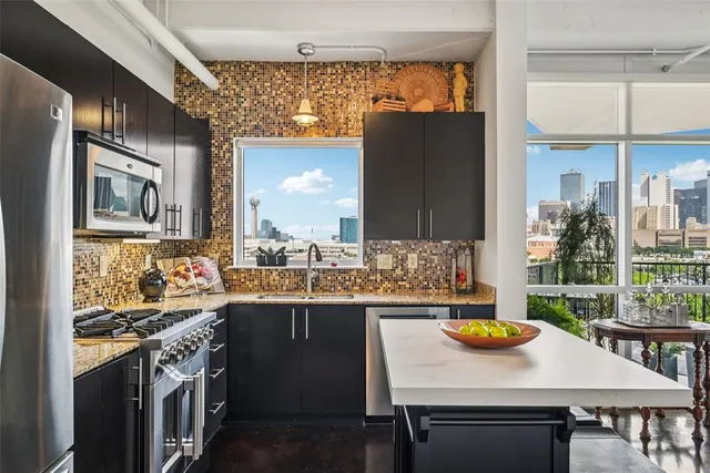 a kitchen with a table and chairs