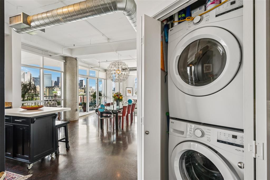 1001 Belleview Street, Unit 708 Dallas, TX 75215 - Photo 15 of 40 a view of a hallway with washer and dryer