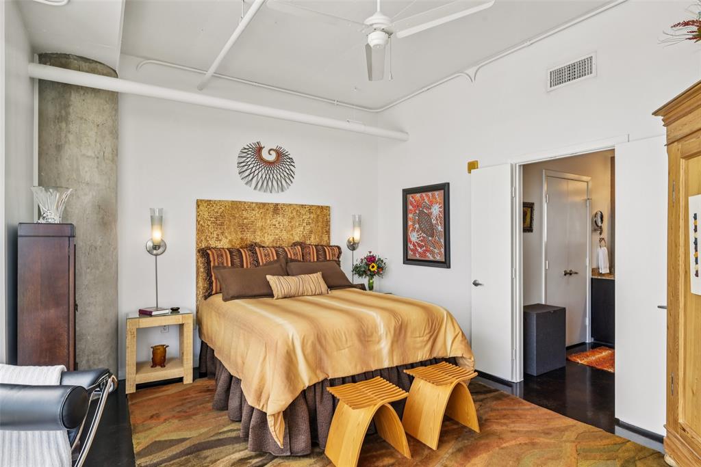 1001 Belleview Street, Unit 708 Dallas, TX 75215 - Photo 16 of 40 a bedroom with a bed and wooden floor