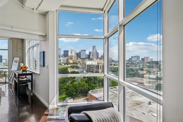 a bed room with a bed and a large window