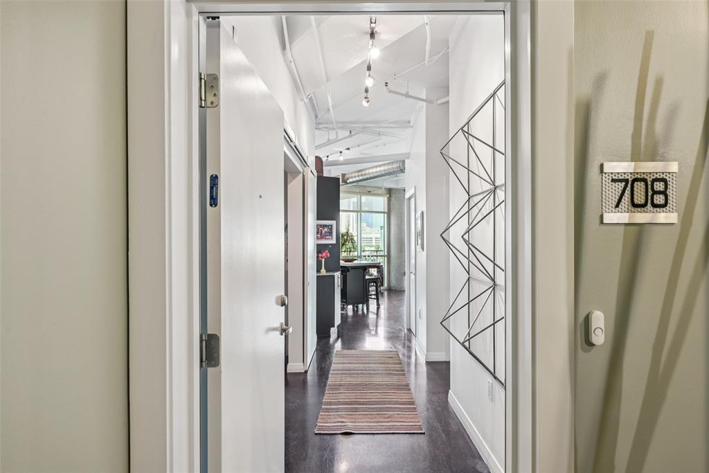 1001 Belleview Street, Unit 708 Dallas, TX 75215 - Photo 22 of 40 a view of entryway and hall with wooden floor