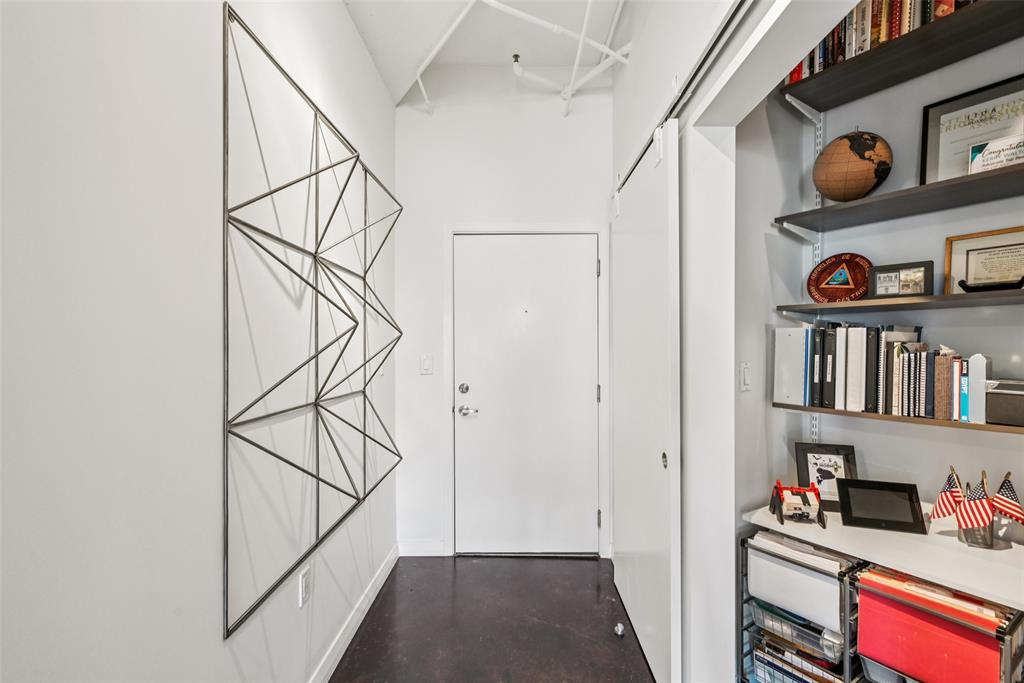 1001 Belleview Street, Unit 708 Dallas, TX 75215 - Photo 24 of 40 a view of an entryway with wooden shelves