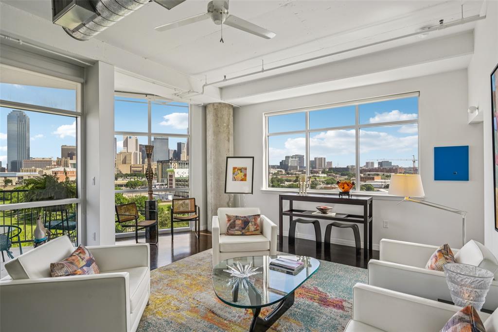1001 Belleview Street, Unit 708 Dallas, TX 75215 - Photo 9 of 40 a living room with fireplace furniture and a large window