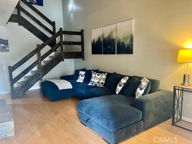 25729 Tournament Road Valencia, CA 91355 - Photo 13 of 31 a living room with furniture and a painting on the wall