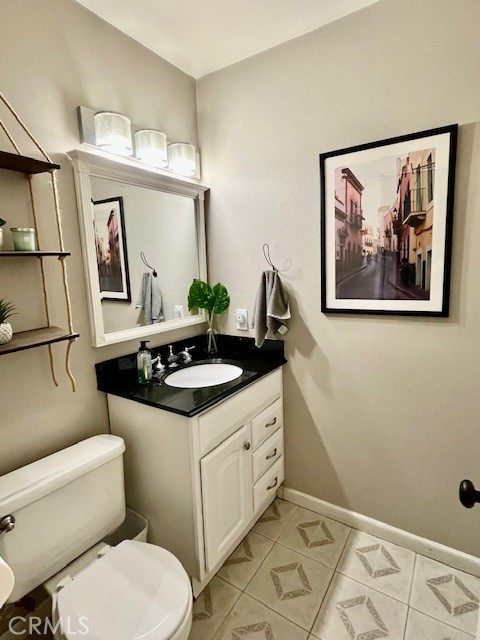 25729 Tournament Road Valencia, CA 91355 - Photo 14 of 29 a bathroom with a sink mirror vanity and toilet