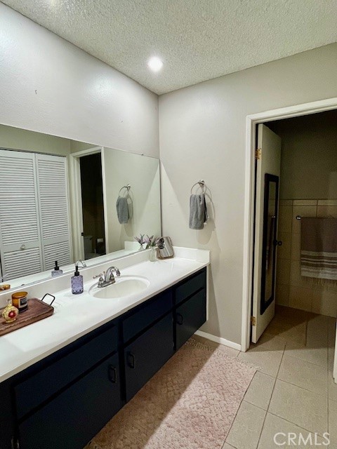 25729 Tournament Road Valencia, CA 91355 - Photo 20 of 31 a bathroom with a sink and a mirror