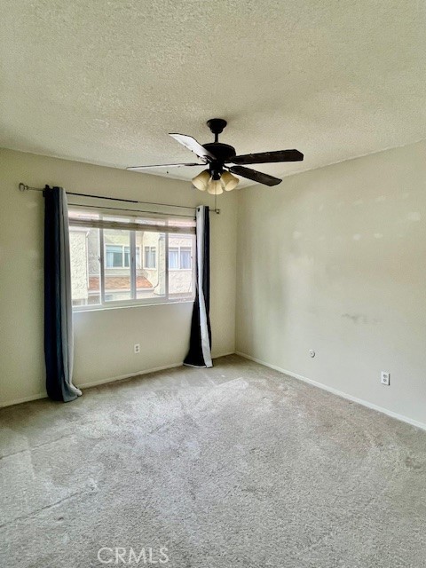 25729 Tournament Road Valencia, CA 91355 - Photo 24 of 31 an empty room with windows and fan