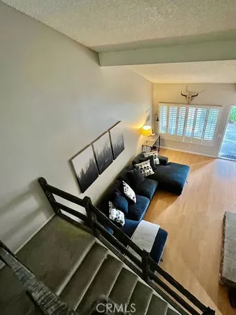 a view of a patio with table and chairs and potted plants