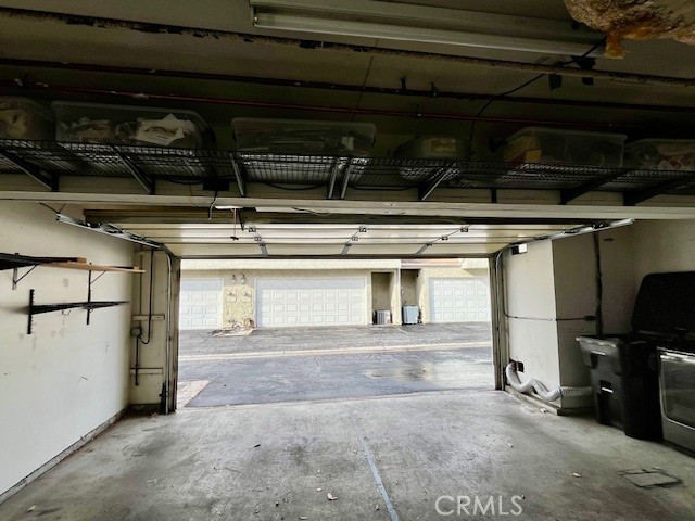 25729 Tournament Road Valencia, CA 91355 - Photo 28 of 31 a view of a refrigerator with wooden cabinets