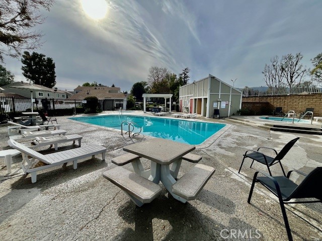 25729 Tournament Road Valencia, CA 91355 - Photo 31 of 31 a view of a patio with table and chairs and potted plants