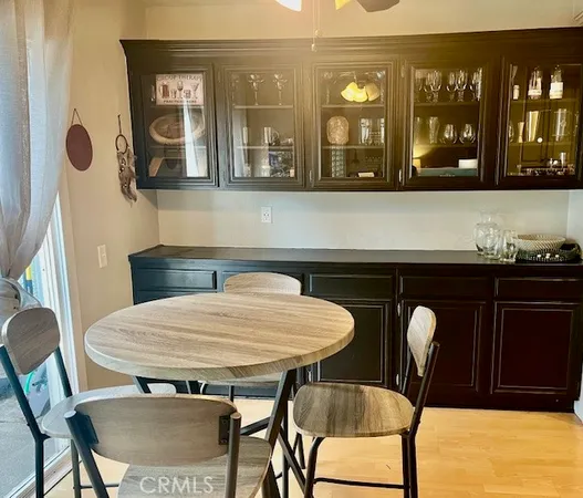 a living room with furniture and a painting on the wall