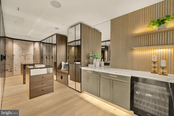 a spacious bathroom with a double vanity sink a mirror and a bathtub
