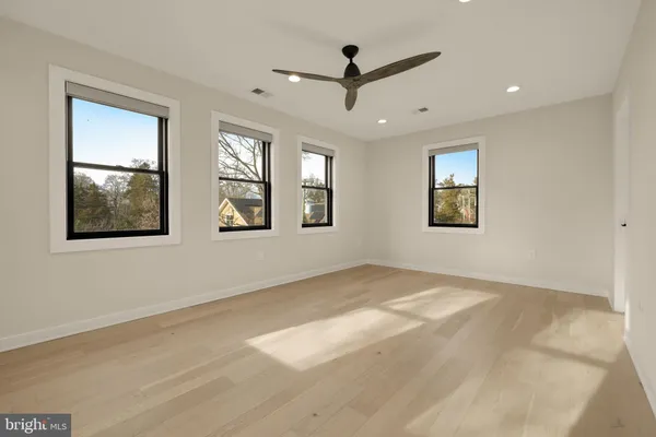 a view of empty room with windows