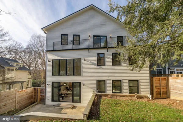 a view of a patio with table and chairs and wooden floor