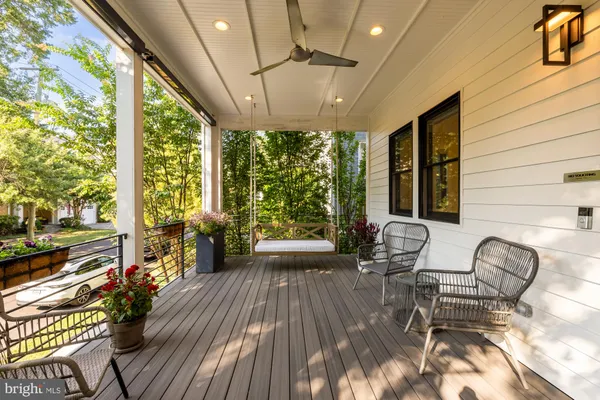 a view of a balcony with wooden floor