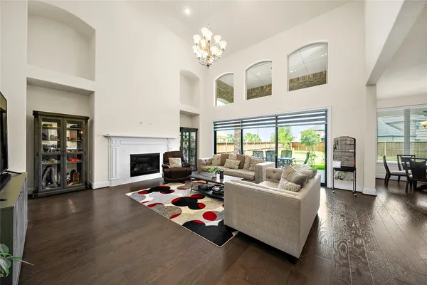 a living room with furniture fireplace and flat screen tv