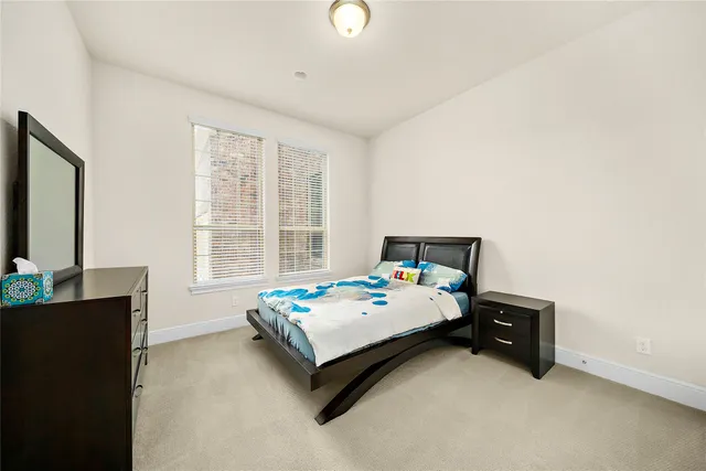 a bedroom with bed and a window