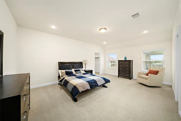 a bedroom with bed and furniture