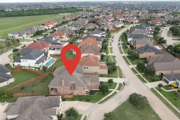 an aerial view of residential houses with outdoor space