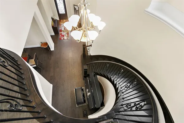 a view of staircase with wooden floor