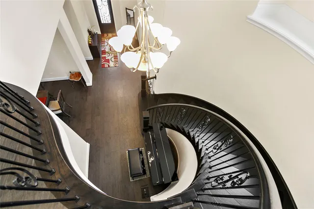 a view of staircase with wooden floor