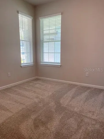 a close view of a sink and dishwasher in a white cabinet
