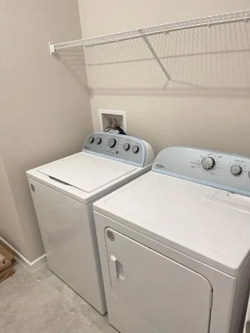 a view of a house with pool plants and trees
