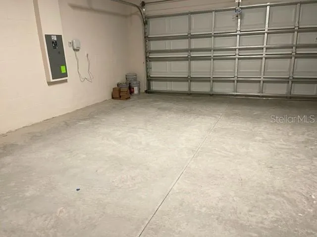 a front view of multiple houses with yard and green space