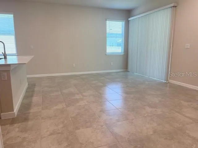 a kitchen with stainless steel appliances a refrigerator sink and microwave