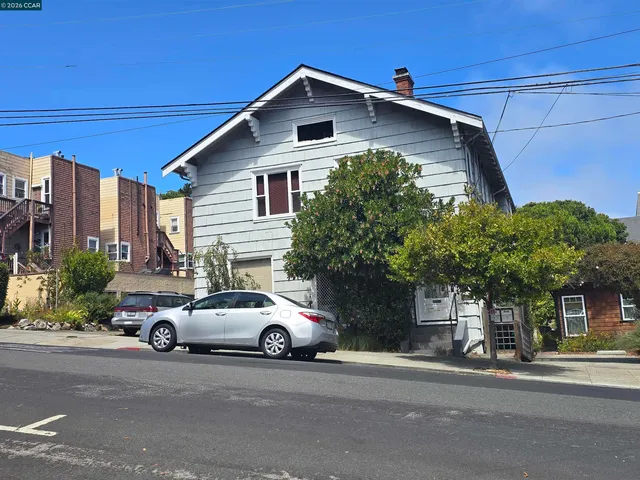 a car parked in front of a house