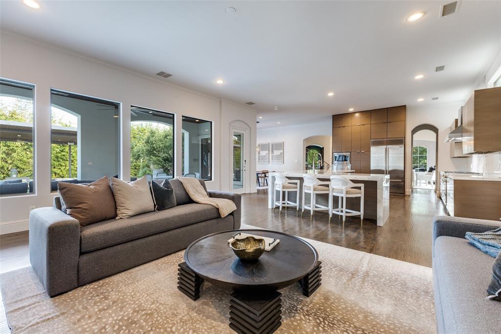 8647 Wingate Drive Dallas, TX 75209 - Photo 11 of 27 a living room with furniture a dining table and a large window