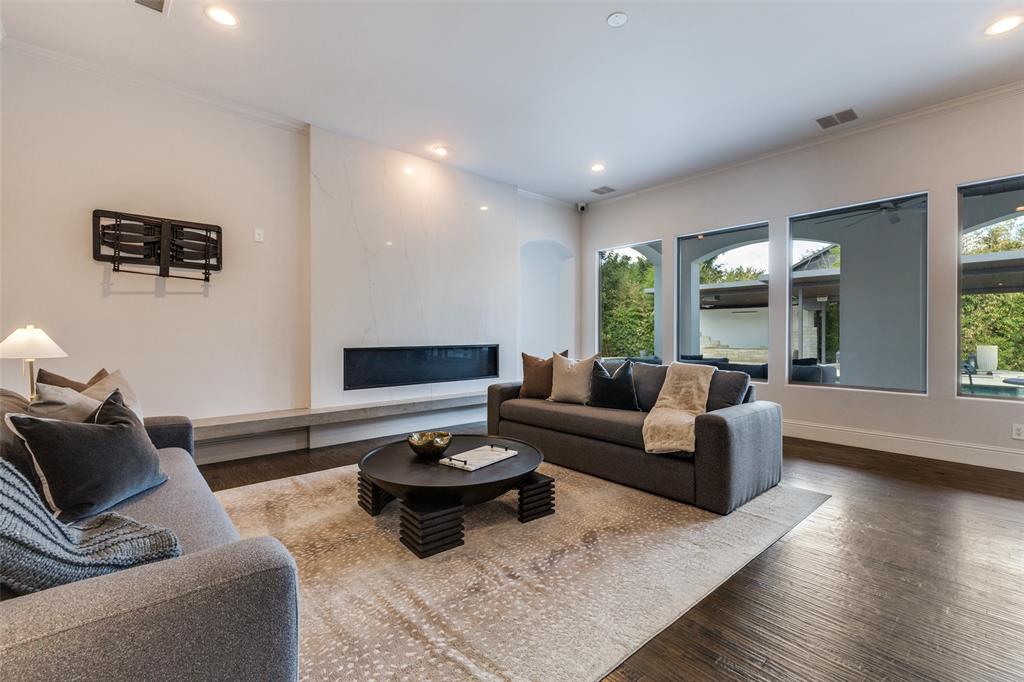 8647 Wingate Drive Dallas, TX 75209 - Photo 12 of 27 a living room with furniture and wooden floor