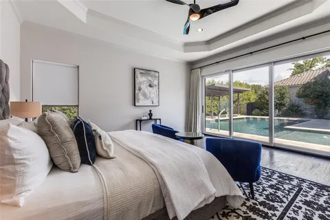 a bedroom with a large bed and a large window