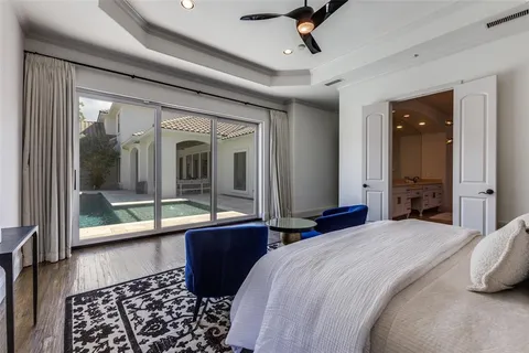 a bedroom with a large bed and a large window