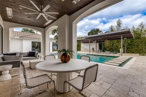 a outdoor dining space with furniture and garden view