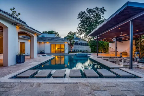 a swimming pool with outdoor seating
