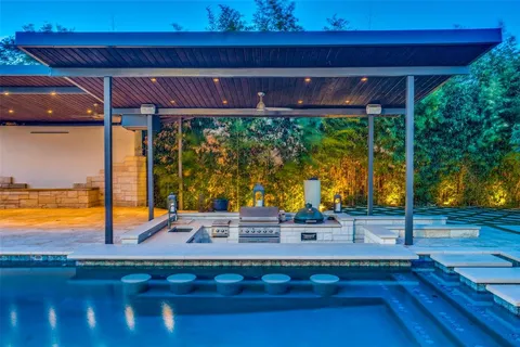 a room with pool table and a floor to ceiling window